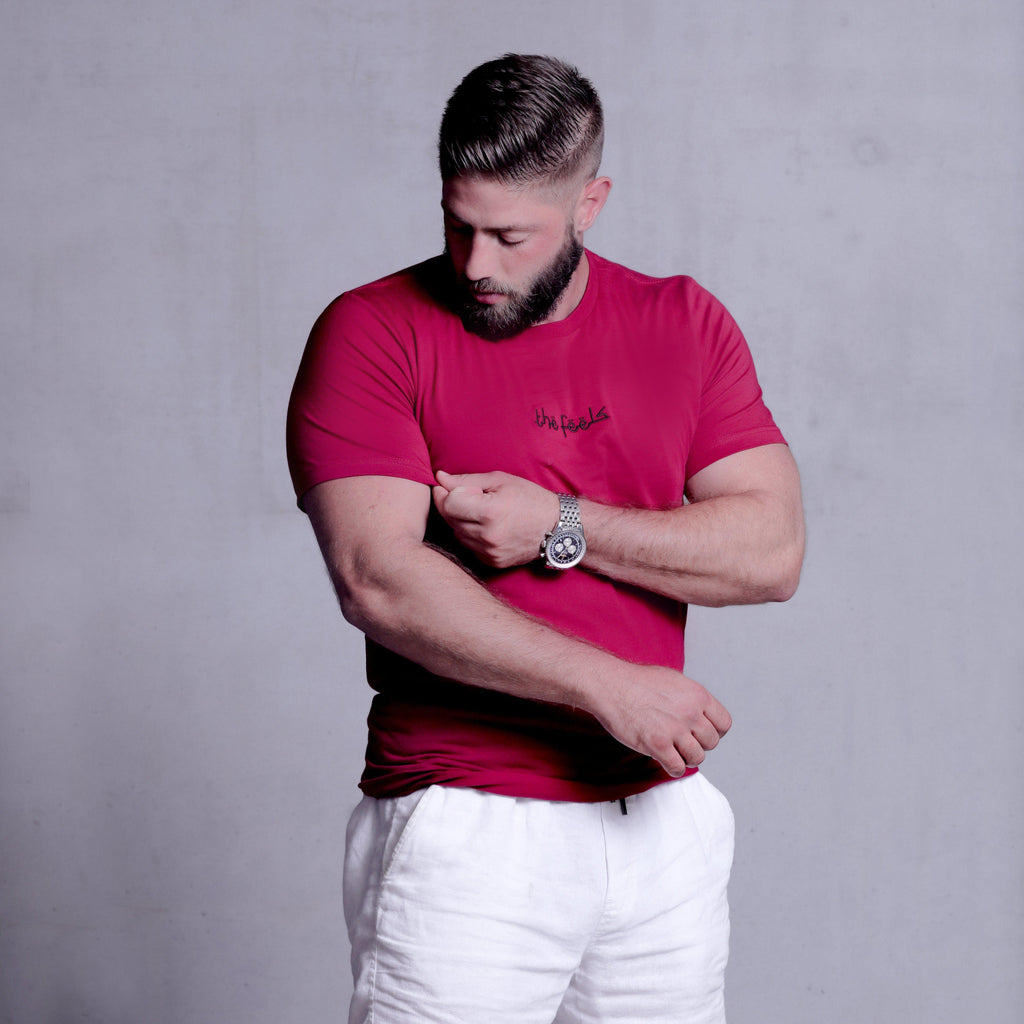 bearded muscle guy posing wearing Premium Cardinal Arabic Script T-shirt with arabic script embroidered