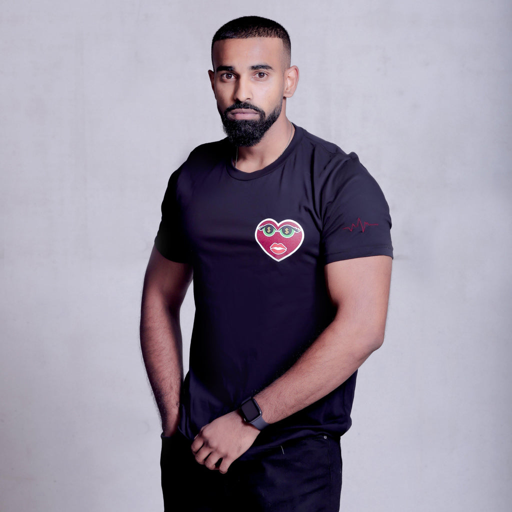 Model is wearing Unisex Money Eyes Black T-shirt showing off his muscles