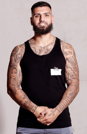 middle eastern guy with beard and faded hair cut and tattoos wearing Supreme Mens White Muscle Singlet with a ying yang design showing off his tattoos and muscles