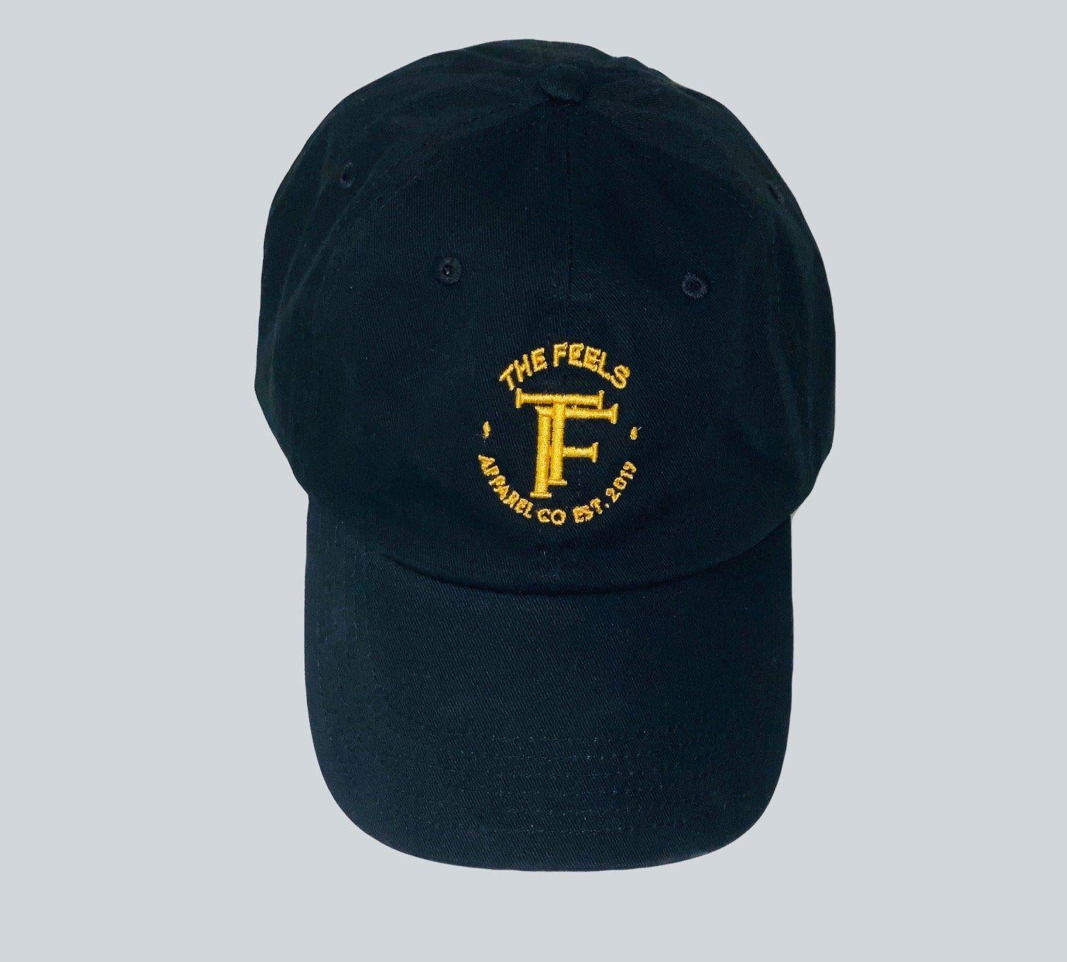Photo of Supreme Black Hat Embroidered Logo with yellow embroidered emblem
