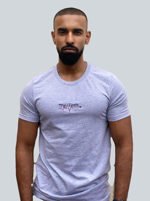 Open image in slideshow, Drake look a like modelling wearing a grey tight Supreme Unisex Heartbeat T-shirt showing off his muscles
